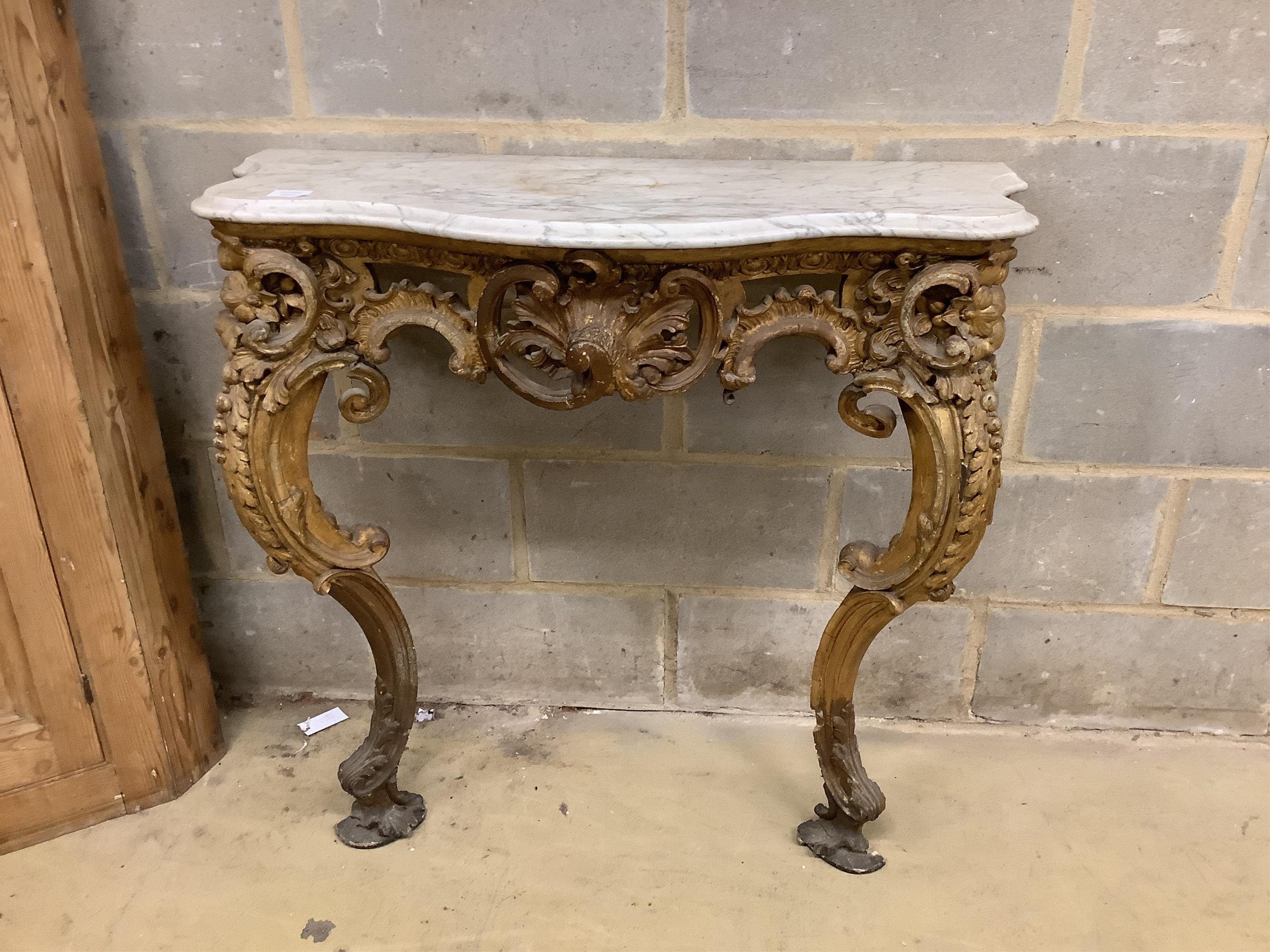 A Victorian giltwood and composition marble top serpentine console table, width 93cm, depth 37cm, height 90cm. Condition - fair